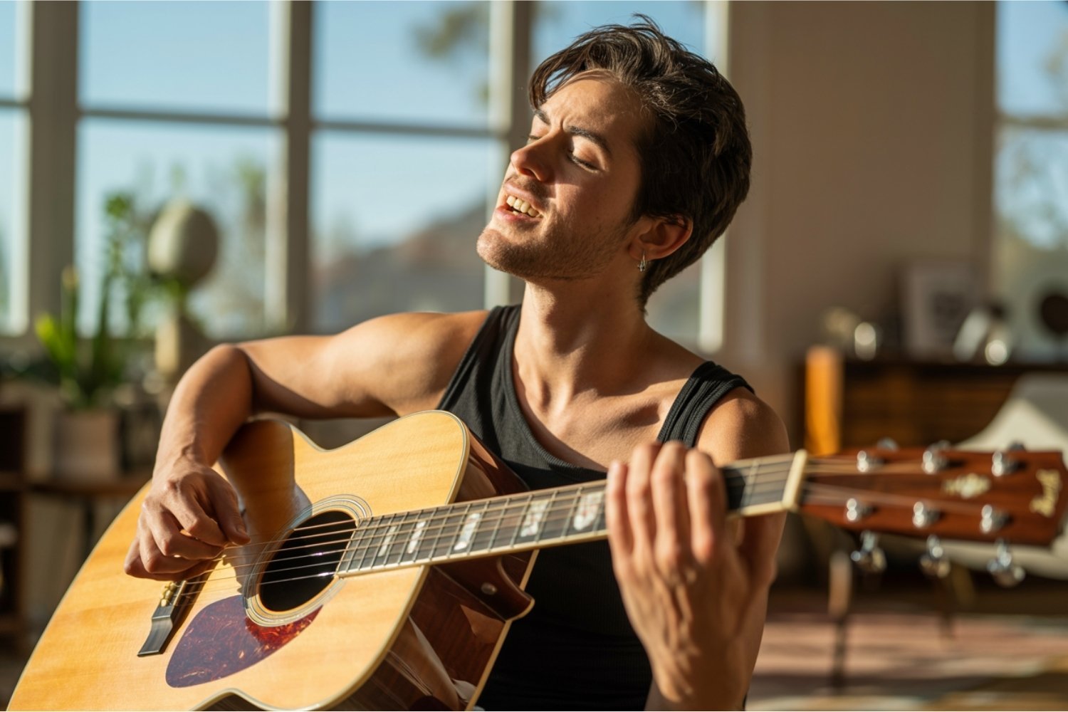 Young musician practicing guitar and manifesting his dreams through aligned action